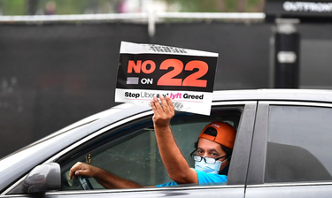 OpenGraph image for defector.com/the-fight-over-the-future-of-work-starts-with-prop-22/
