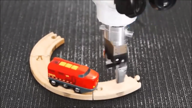 OpenGraph image for laughingsquid.com/robot-continuously-connects-tracks-to-create-an-endless-looping-railroad-for-a-toy-train/