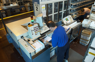 OpenGraph image for kuow.org/stories/post-offices-ordered-not-to-reinstall-recently-removed-mail-sorting-machinery