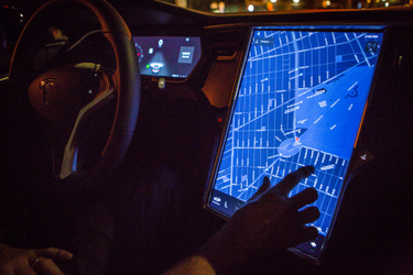 OpenGraph image for vice.com/en/article/y3mb3w/people-are-jailbreaking-used-teslas-to-get-the-features-they-expect